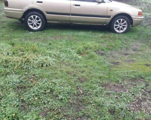 Бежевий Мазда 323, об'ємом двигуна 1.7 л та пробігом 100 тис. км за 1500 $, фото 1 на Automoto.ua