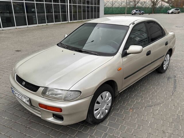 Бежевый Мазда 323, объемом двигателя 1.5 л и пробегом 220 тыс. км за 1500 $, фото 1 на Automoto.ua