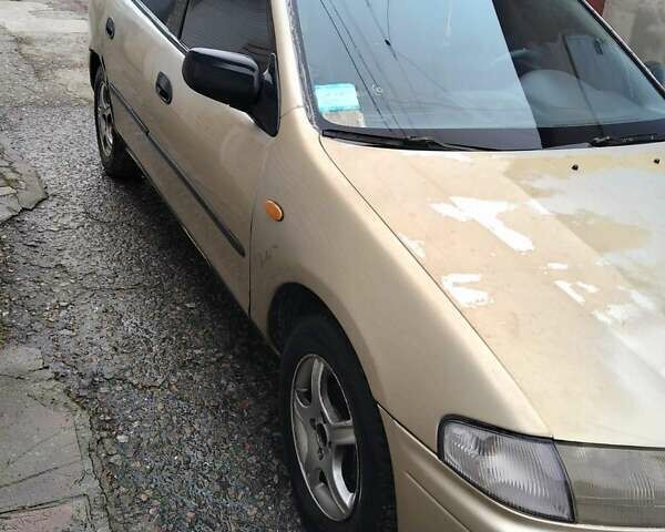 Бежевый Мазда 323, объемом двигателя 1.5 л и пробегом 334 тыс. км за 1200 $, фото 1 на Automoto.ua