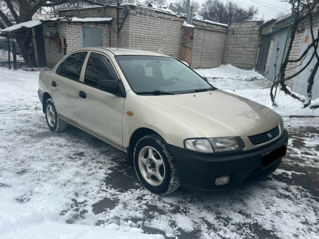 Бежевий Мазда 323, об'ємом двигуна 1.5 л та пробігом 300 тис. км за 1990 $, фото 1 на Automoto.ua