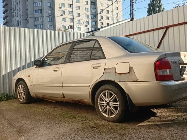 Бежевый Мазда 323, объемом двигателя 2 л и пробегом 300 тыс. км за 447 $, фото 1 на Automoto.ua