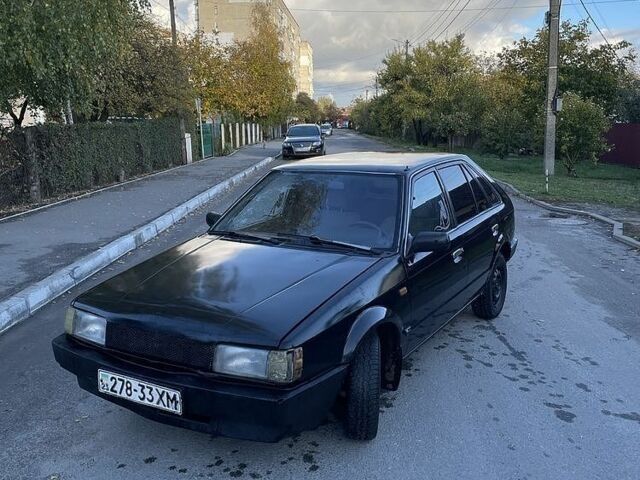 Черный Мазда 323, объемом двигателя 1.5 л и пробегом 224 тыс. км за 1047 $, фото 1 на Automoto.ua