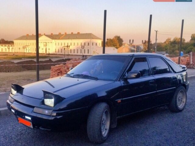 Чорний Мазда 323, об'ємом двигуна 1.8 л та пробігом 300 тис. км за 2000 $, фото 1 на Automoto.ua