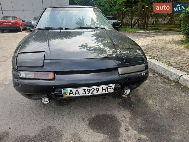 Черный Мазда 323, объемом двигателя 1.8 л и пробегом 313 тыс. км за 650 $, фото 1 на Automoto.ua