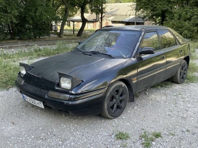 Чорний Мазда 323, об'ємом двигуна 1.9 л та пробігом 257 тис. км за 883 $, фото 1 на Automoto.ua
