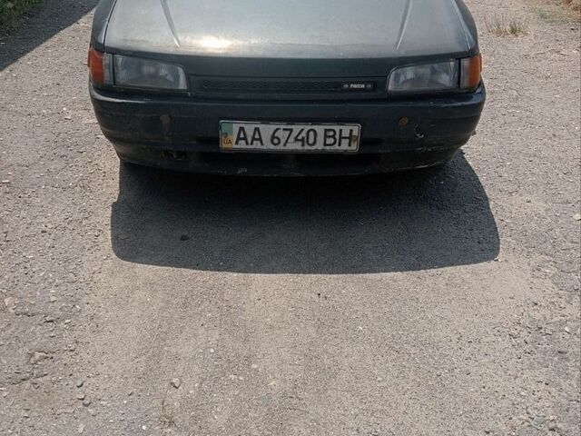 Чорний Мазда 323, об'ємом двигуна 1.3 л та пробігом 150 тис. км за 900 $, фото 1 на Automoto.ua