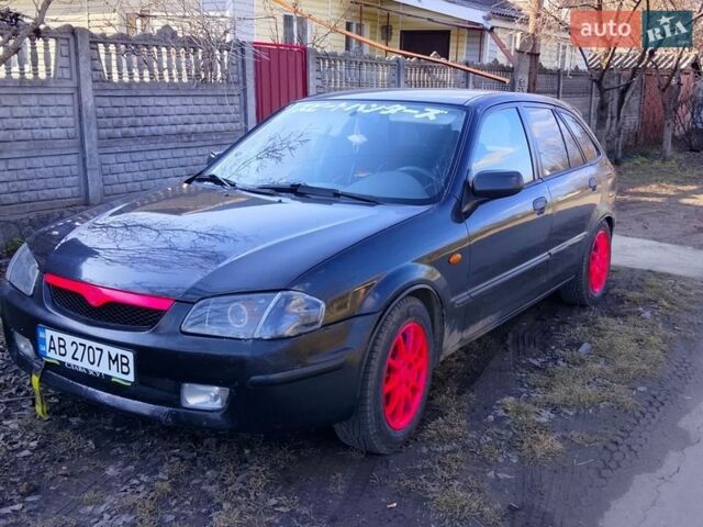 Чорний Мазда 323, об'ємом двигуна 1.49 л та пробігом 250 тис. км за 1400 $, фото 1 на Automoto.ua