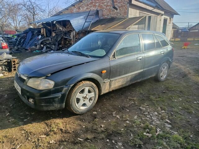 Черный Мазда 323, объемом двигателя 0 л и пробегом 268 тыс. км за 300 $, фото 1 на Automoto.ua