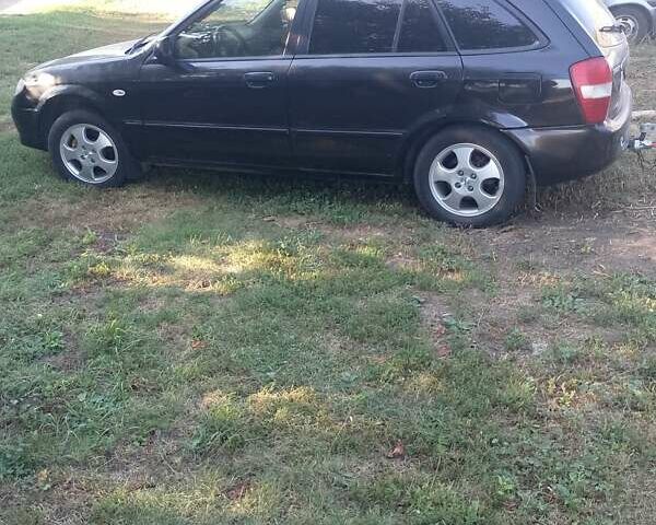 Чорний Мазда 323, об'ємом двигуна 1.6 л та пробігом 255 тис. км за 1900 $, фото 1 на Automoto.ua