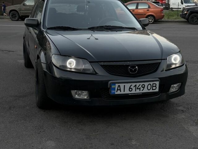 Чорний Мазда 323, об'ємом двигуна 2 л та пробігом 300 тис. км за 1850 $, фото 1 на Automoto.ua