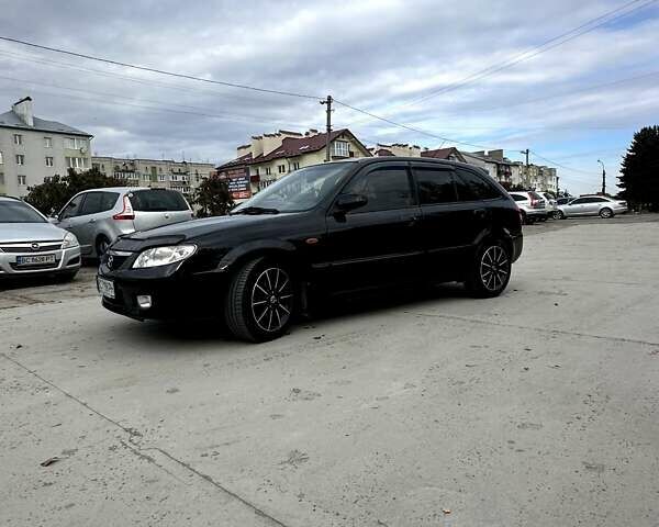 Черный Мазда 323, объемом двигателя 2 л и пробегом 286 тыс. км за 3200 $, фото 1 на Automoto.ua