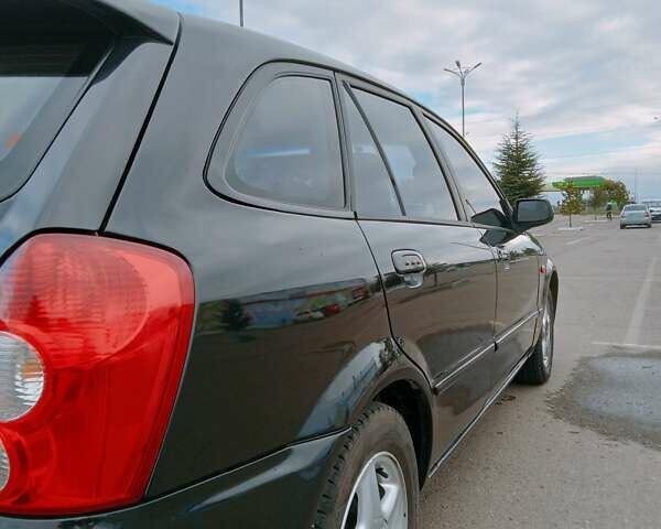 Черный Мазда 323, объемом двигателя 1.6 л и пробегом 305 тыс. км за 3800 $, фото 1 на Automoto.ua