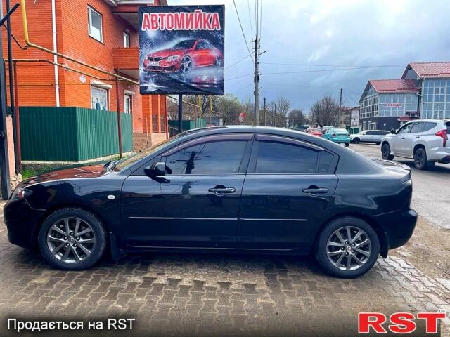 Черный Мазда 323, объемом двигателя 2 л и пробегом 292 тыс. км за 4350 $, фото 1 на Automoto.ua