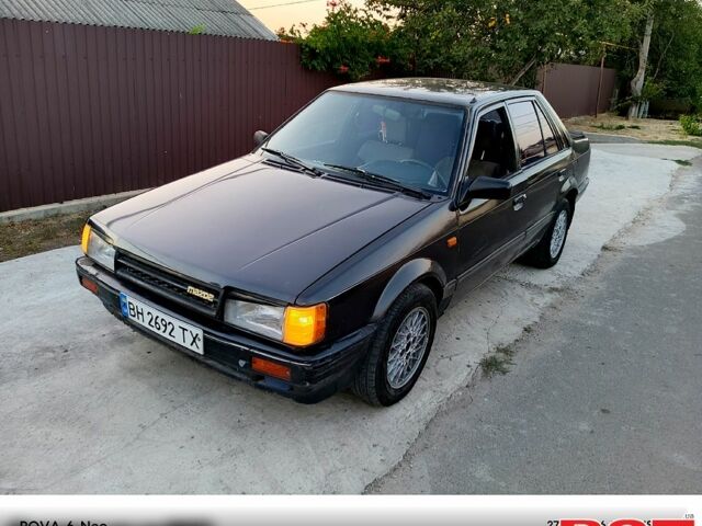 Черный Мазда 323, объемом двигателя 1.6 л и пробегом 300 тыс. км за 750 $, фото 1 на Automoto.ua