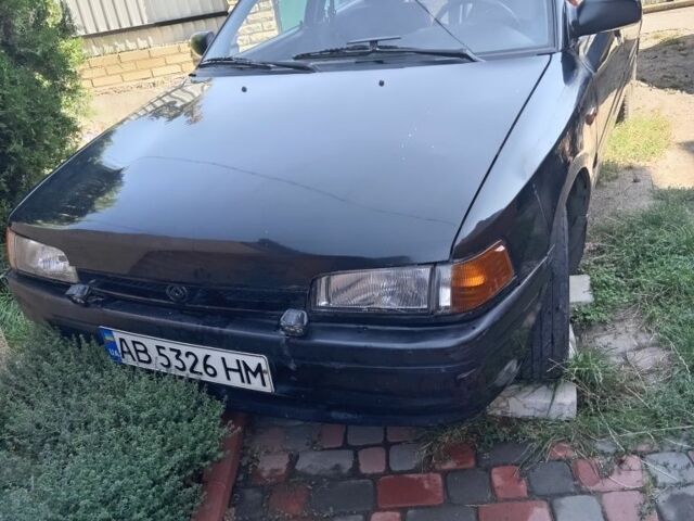 Черный Мазда 323, объемом двигателя 1.7 л и пробегом 187 тыс. км за 1500 $, фото 1 на Automoto.ua