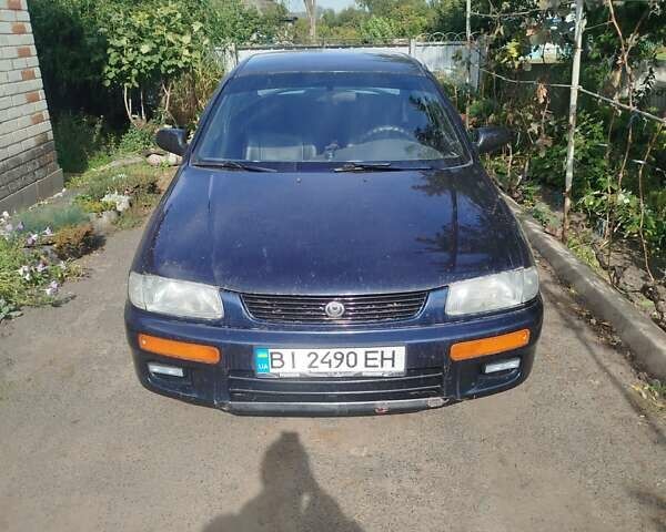 Черный Мазда 323, объемом двигателя 1.49 л и пробегом 319 тыс. км за 2400 $, фото 1 на Automoto.ua