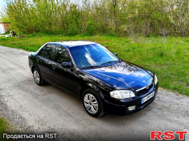 Черный Мазда 323, объемом двигателя 1.6 л и пробегом 217 тыс. км за 2900 $, фото 1 на Automoto.ua