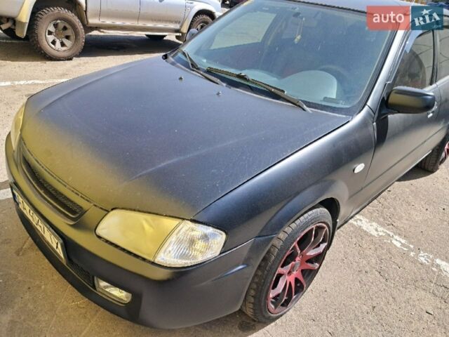 Чорний Мазда 323, об'ємом двигуна 1.6 л та пробігом 387 тис. км за 4000 $, фото 1 на Automoto.ua
