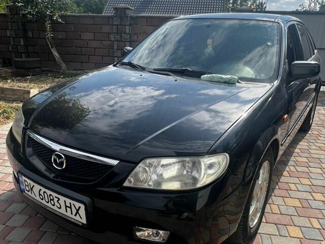 Чорний Мазда 323, об'ємом двигуна 1.6 л та пробігом 180 тис. км за 2500 $, фото 1 на Automoto.ua