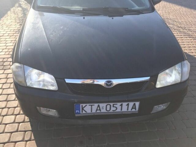 Черный Мазда 323, объемом двигателя 2 л и пробегом 333 тыс. км за 673 $, фото 1 на Automoto.ua