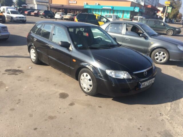 Чорний Мазда 323, об'ємом двигуна 2 л та пробігом 200 тис. км за 950 $, фото 1 на Automoto.ua
