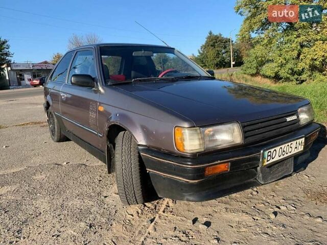Коричневый Мазда 323, объемом двигателя 1.3 л и пробегом 475 тыс. км за 1300 $, фото 1 на Automoto.ua