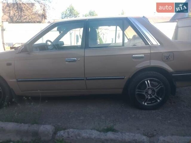Коричневый Мазда 323, объемом двигателя 0 л и пробегом 230 тыс. км за 1300 $, фото 1 на Automoto.ua