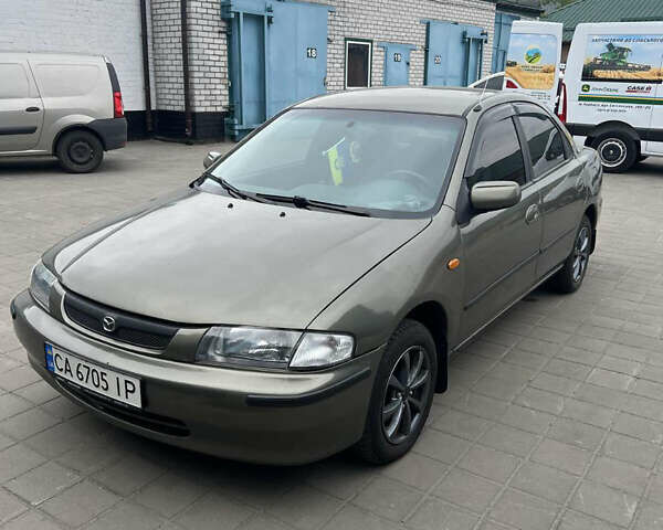 Коричневый Мазда 323, объемом двигателя 1.6 л и пробегом 199 тыс. км за 2600 $, фото 1 на Automoto.ua