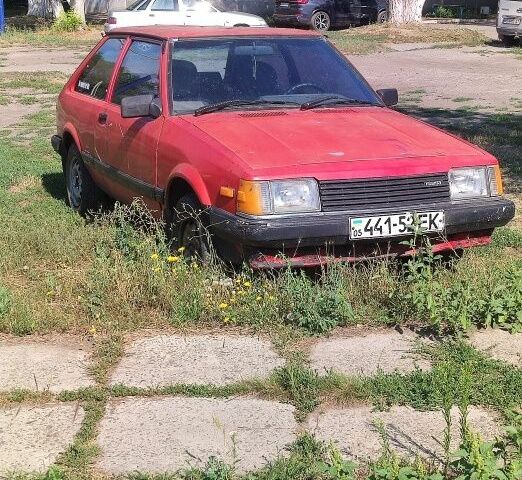 Красный Мазда 323, объемом двигателя 1.5 л и пробегом 450 тыс. км за 560 $, фото 1 на Automoto.ua