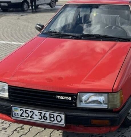 Красный Мазда 323, объемом двигателя 0 л и пробегом 300 тыс. км за 168 $, фото 1 на Automoto.ua