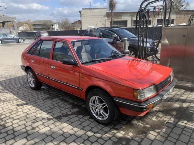 Червоний Мазда 323, об'ємом двигуна 1.3 л та пробігом 250 тис. км за 2505 $, фото 1 на Automoto.ua