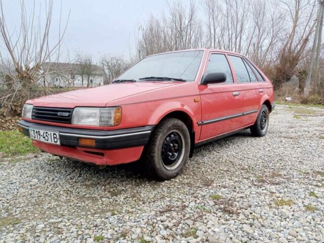 Червоний Мазда 323, об'ємом двигуна 1.3 л та пробігом 250 тис. км за 950 $, фото 1 на Automoto.ua