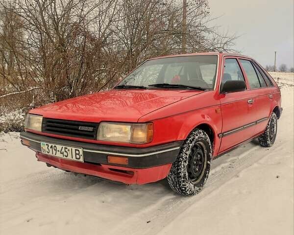 Красный Мазда 323, объемом двигателя 1.3 л и пробегом 250 тыс. км за 1200 $, фото 1 на Automoto.ua