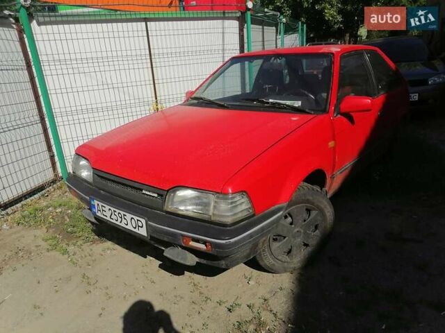 Красный Мазда 323, объемом двигателя 1.5 л и пробегом 408 тыс. км за 800 $, фото 1 на Automoto.ua