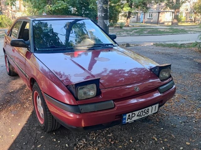 Красный Мазда 323, объемом двигателя 1.8 л и пробегом 444 тыс. км за 1200 $, фото 1 на Automoto.ua