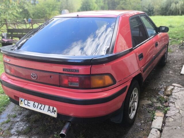 Красный Мазда 323, объемом двигателя 1 л и пробегом 317 тыс. км за 1100 $, фото 1 на Automoto.ua