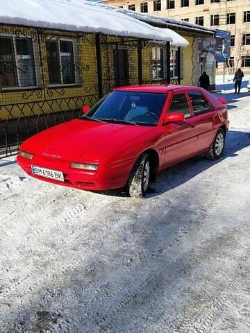 Червоний Мазда 323, об'ємом двигуна 1.6 л та пробігом 322 тис. км за 2100 $, фото 1 на Automoto.ua