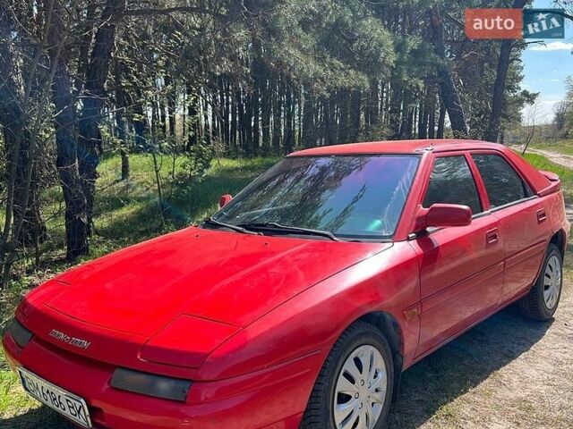 Красный Мазда 323, объемом двигателя 1.6 л и пробегом 322 тыс. км за 1650 $, фото 1 на Automoto.ua