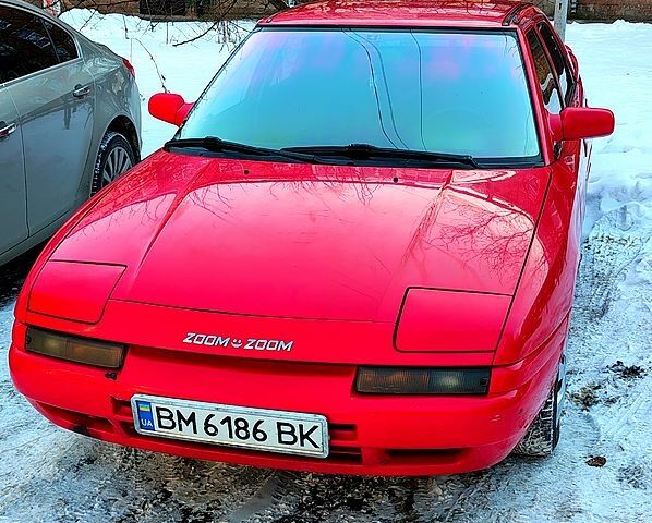 Красный Мазда 323, объемом двигателя 1.6 л и пробегом 322 тыс. км за 2000 $, фото 1 на Automoto.ua
