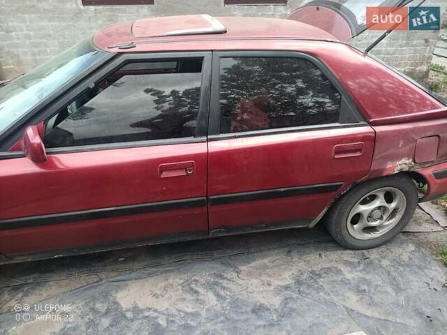 Красный Мазда 323, объемом двигателя 1.6 л и пробегом 1000 тыс. км за 605 $, фото 1 на Automoto.ua