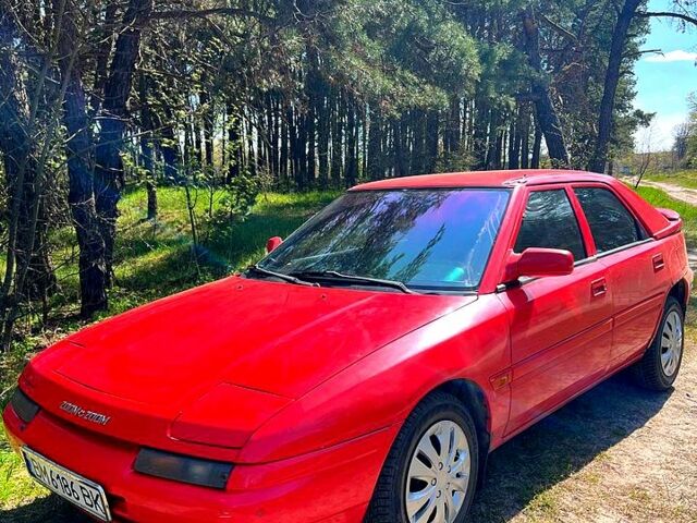 Красный Мазда 323, объемом двигателя 1.6 л и пробегом 322 тыс. км за 1650 $, фото 1 на Automoto.ua