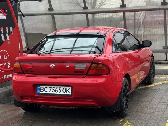 Красный Мазда 323, объемом двигателя 1.5 л и пробегом 344 тыс. км за 1500 $, фото 1 на Automoto.ua