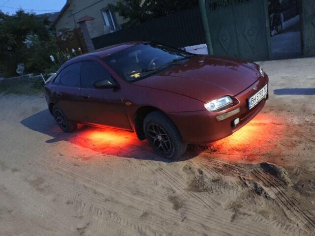 Червоний Мазда 323, об'ємом двигуна 1.5 л та пробігом 316 тис. км за 1615 $, фото 1 на Automoto.ua