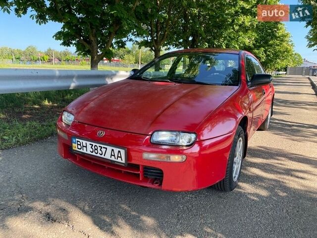 Красный Мазда 323, объемом двигателя 1.49 л и пробегом 250 тыс. км за 1750 $, фото 1 на Automoto.ua