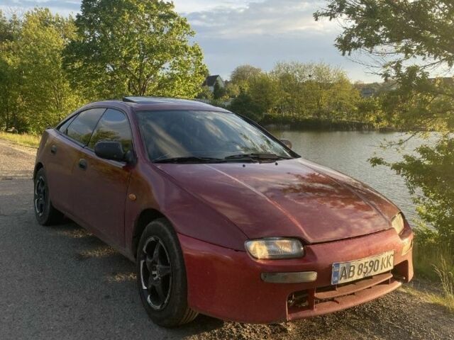 Красный Мазда 323, объемом двигателя 1.5 л и пробегом 639 тыс. км за 2100 $, фото 1 на Automoto.ua