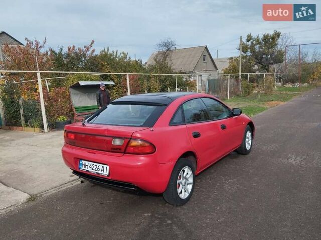 Красный Мазда 323, объемом двигателя 1.5 л и пробегом 258 тыс. км за 1600 $, фото 1 на Automoto.ua