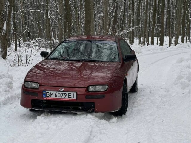Красный Мазда 323, объемом двигателя 1.5 л и пробегом 390 тыс. км за 2450 $, фото 1 на Automoto.ua