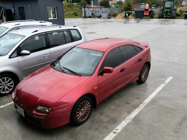 Красный Мазда 323, объемом двигателя 1.5 л и пробегом 431 тыс. км за 2700 $, фото 1 на Automoto.ua