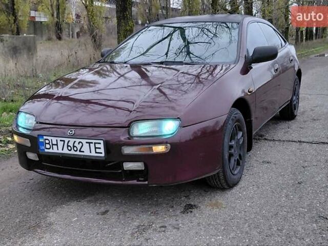 Красный Мазда 323, объемом двигателя 1.49 л и пробегом 153 тыс. км за 1700 $, фото 1 на Automoto.ua