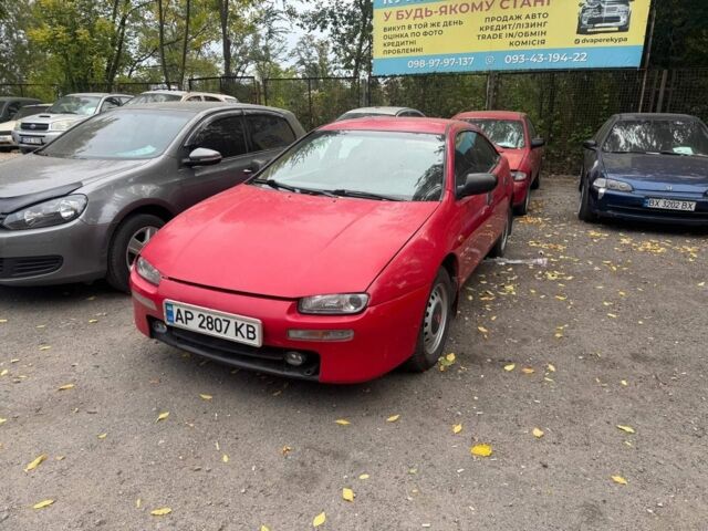 Красный Мазда 323, объемом двигателя 1.5 л и пробегом 150 тыс. км за 1500 $, фото 1 на Automoto.ua